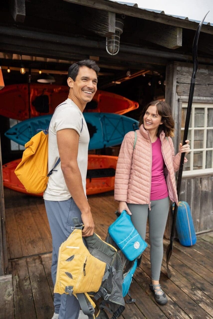 a couple prepares to embark on their kayak trip - outdoor lifestyle photography