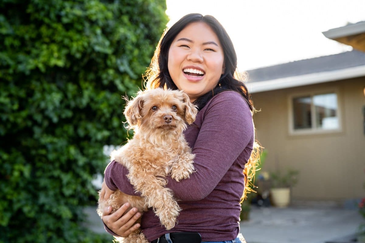 Commercial Photography of a woman holding her dog